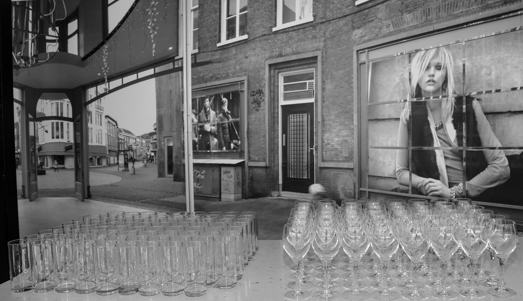 Rows of clean glasses prepared for a reception at an event venue in The Hague.