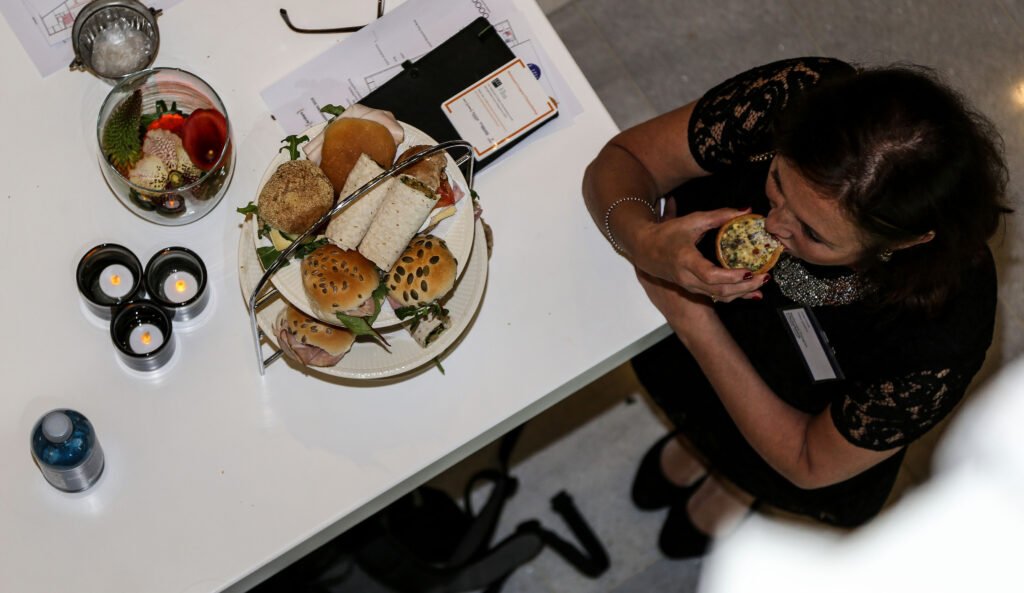 Attendee enjoying lunch at a corporate networking event in The Hague.