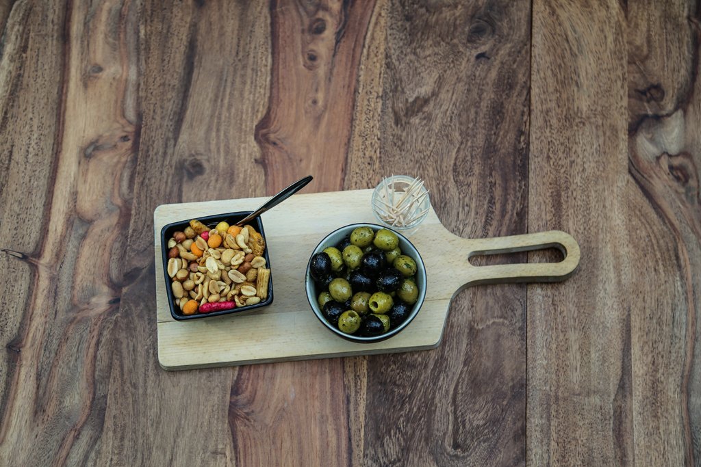 Rows of wine glasses prepared for a reception at a corporate event in The Hague.