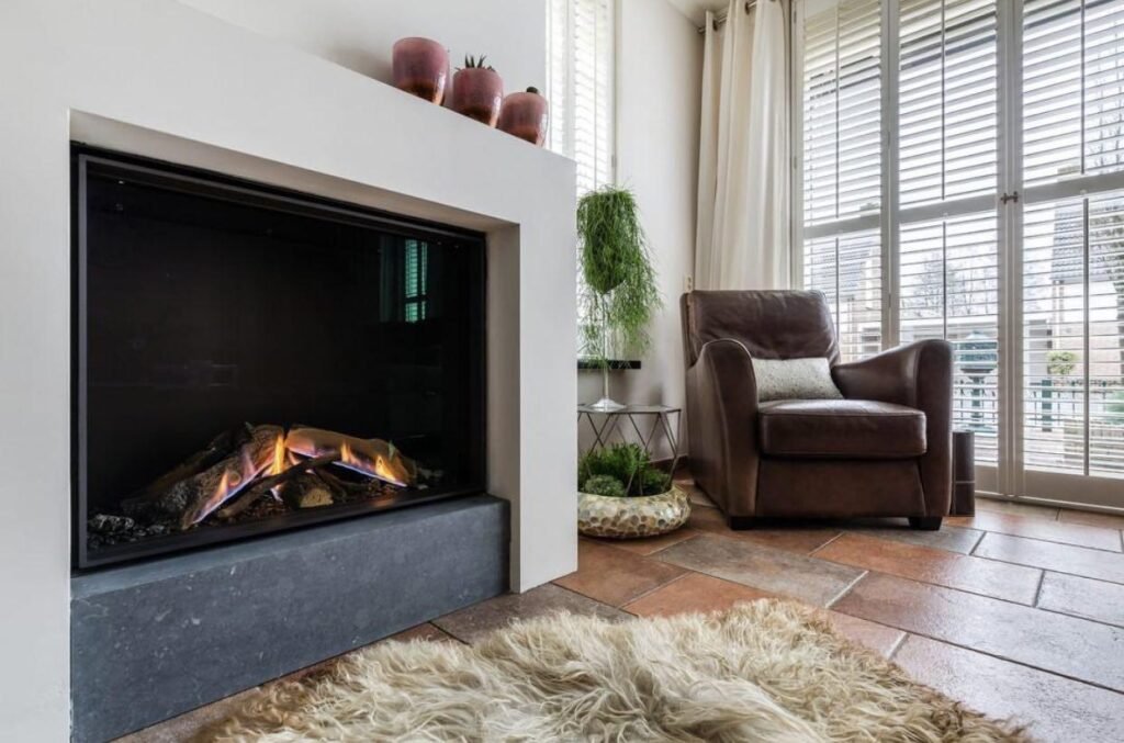 Cozy fireplace corner with leather armchair and warm decor in a The Hague residence