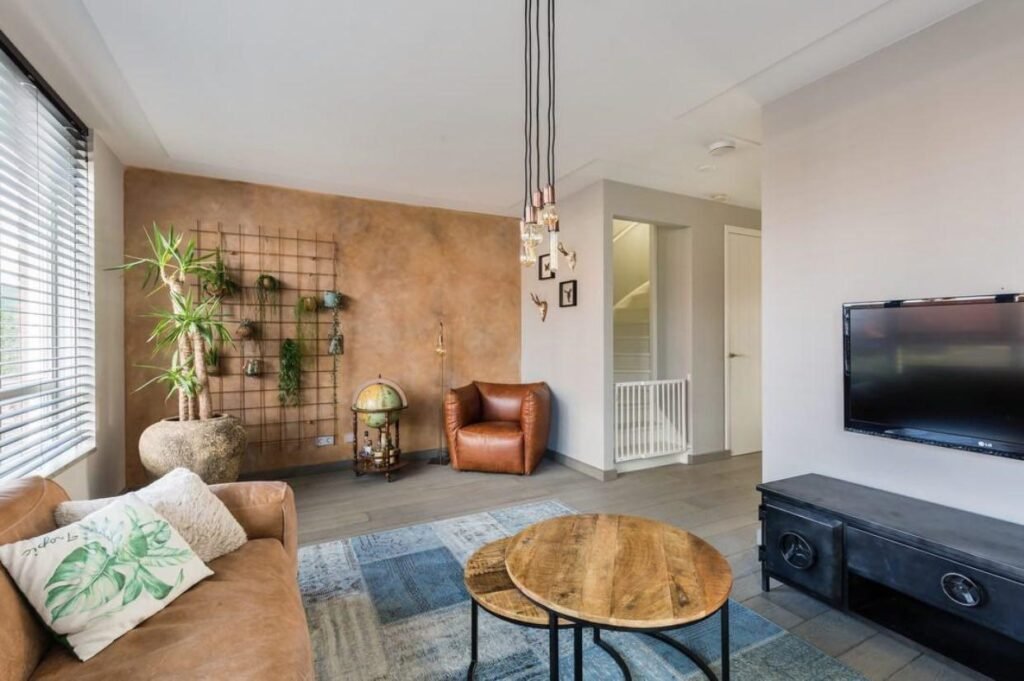 Modern family living room with warm tones and decorative wall features in The Hague.