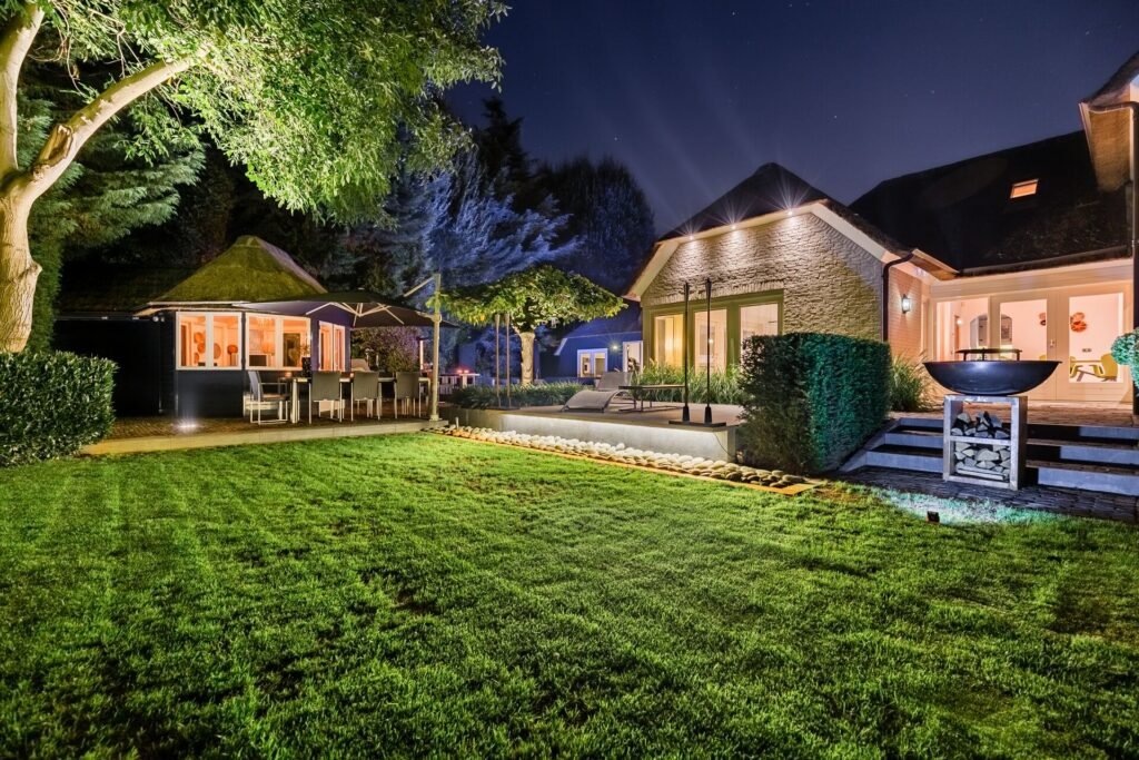 Illuminated garden and terrace of a luxury home at night in The Hague