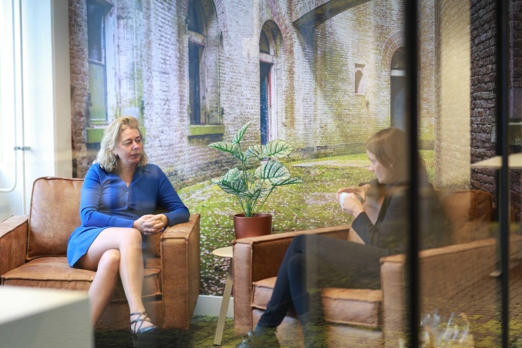 Two women having a business meeting in a modern office in The Hague